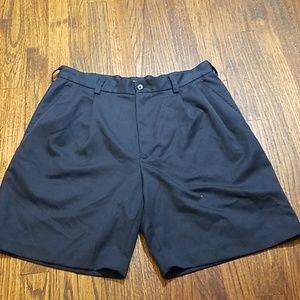 (33) Izod XFG Navy Pleated Shorts